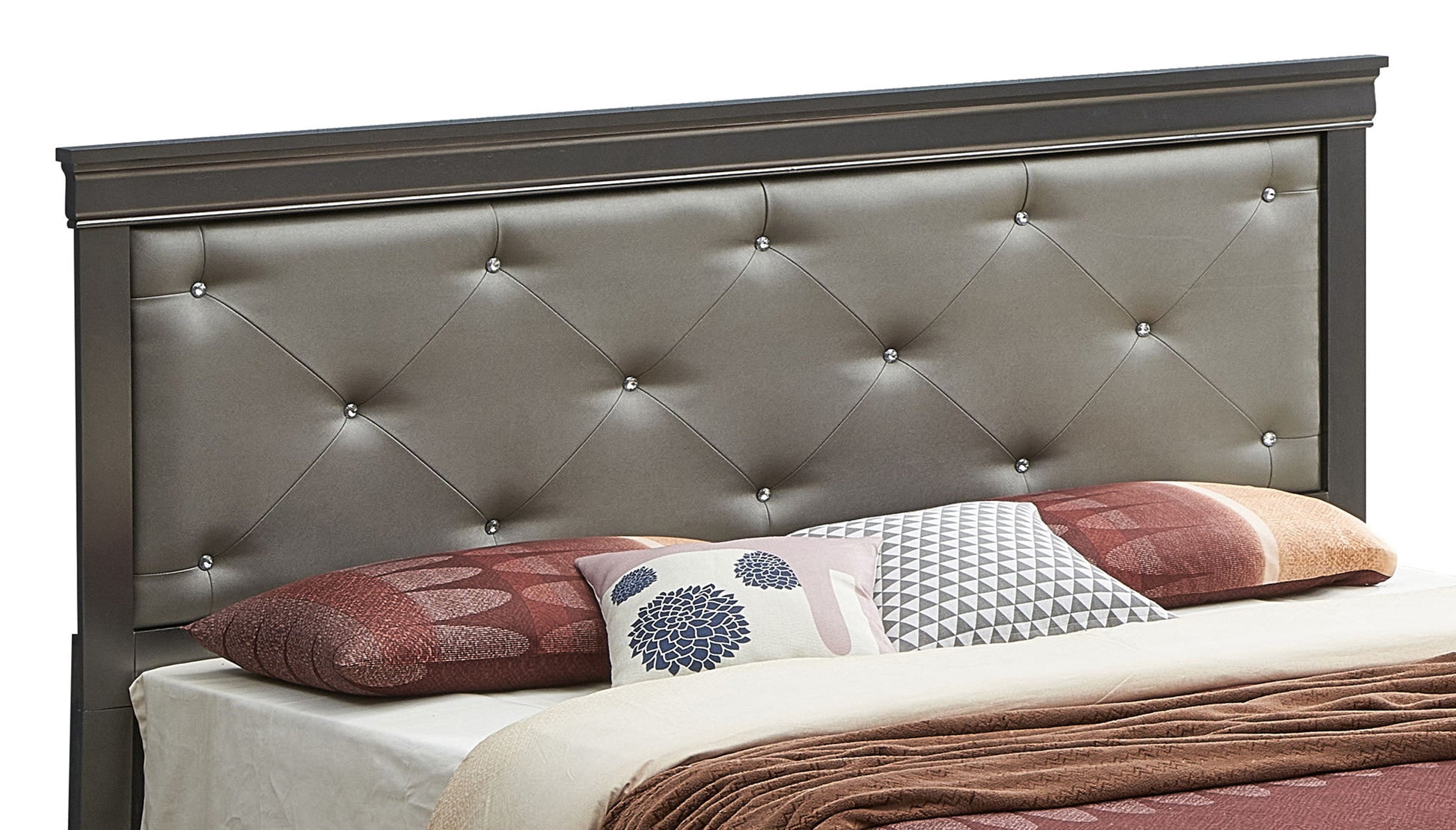 The Chic Elegantly Designed Transitional Bed features a tufted, upholstered gray headboard with button accents and is styled with brown and beige bedding plus several patterned pillows.