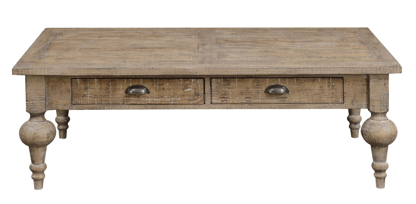 The Ludin Coffee Table in taupe features a rustic wooden design with a distressed finish, two front drawers with metal handles, and turned legs.
