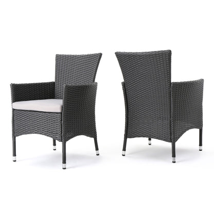 Set of 2 Dimensional Outdoor Dining Chairs with armrests and light gray cushions, featuring dark gray wicker and iron frames, shown from front and back angles against a white background.
