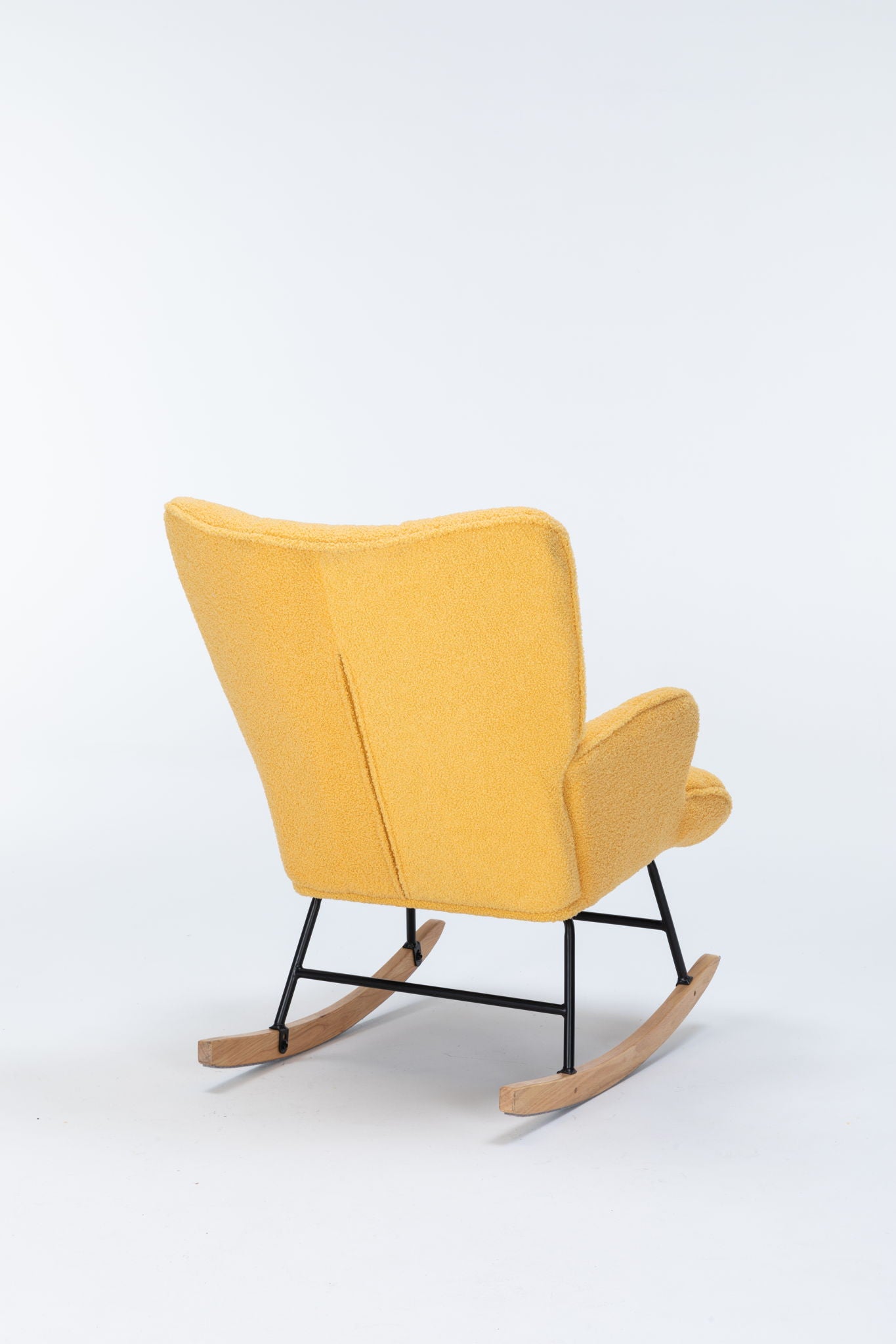 The yellow Rocking Chair Nursery features a teddy upholstered glider rocker with a high backrest and black metal legs, shown from the back and side against a white background—a modern accent chair for living rooms.