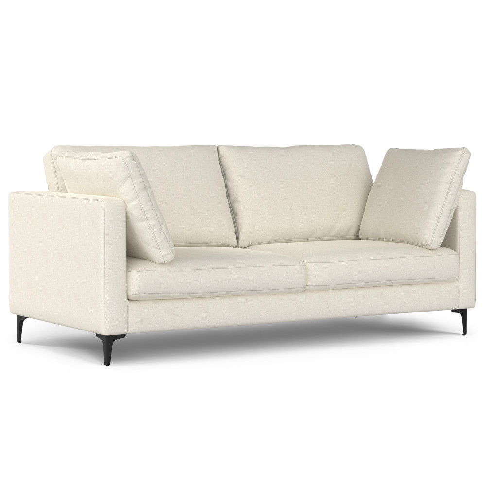 The Ava - Mid Century Sofa With Ottoman Set is a modern three-seater with light beige upholstery, straight arms, three back cushions, and black tapered legs, displayed against a white background.