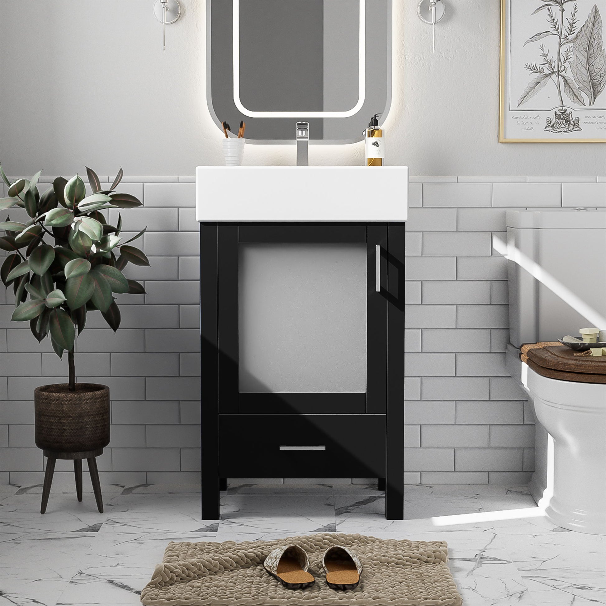 A modern bathroom featuring the Bathroom Vanity With Ceramic Sink And Ample Storage, ideal for small bathrooms, plus a rectangular mirror, potted plant, toilet, botanical print, wall sconces, white tile walls, marble floor, and a woven rug with slippers.