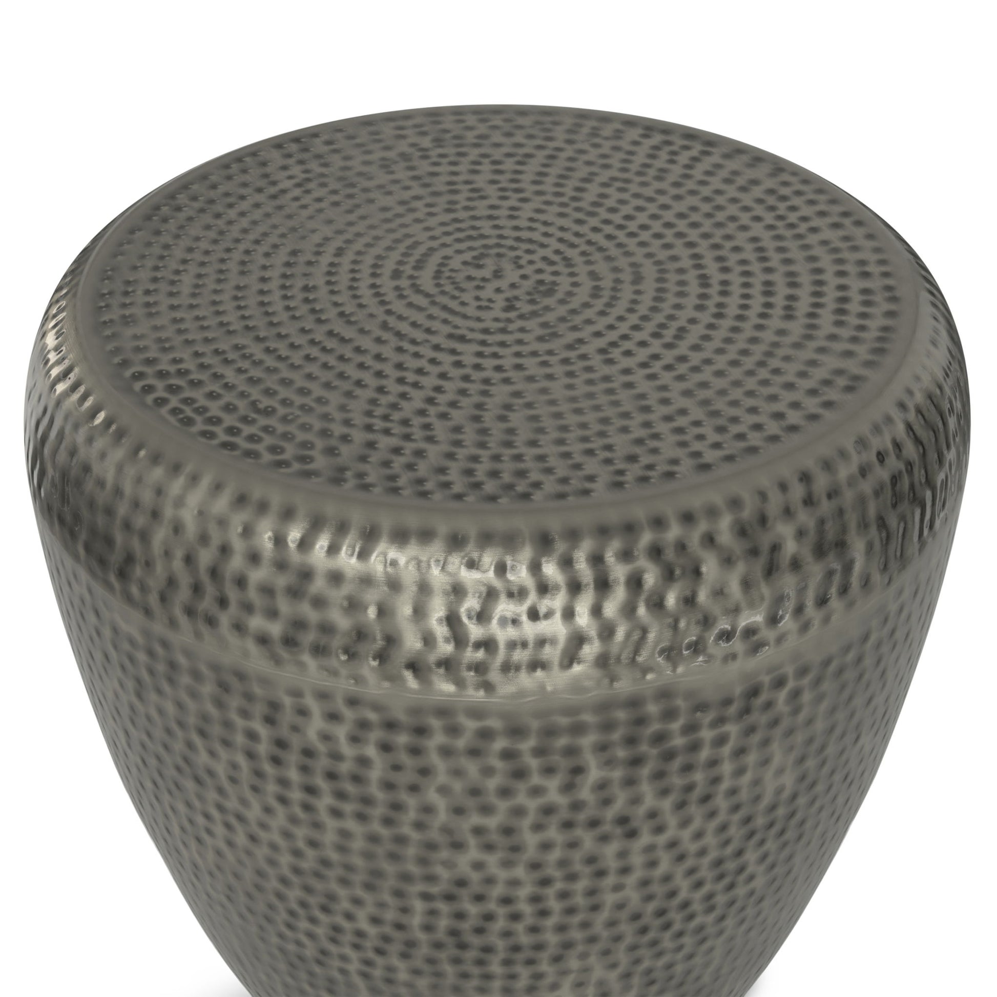 A close-up of the Preston - Handcrafted Metal Side Table highlights its round shape, hammered texture, and dark gray metallic finish, focusing on the top surface and upper sides.