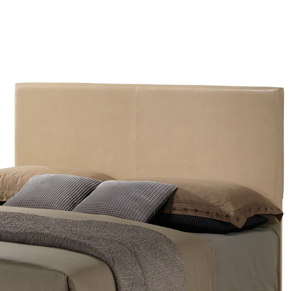 The Elegant Platform Bed For Relaxed Spaces features a beige upholstered headboard and comes with brown and gray bedding, plush pillows, and a textured gray blanket for a cozy look.