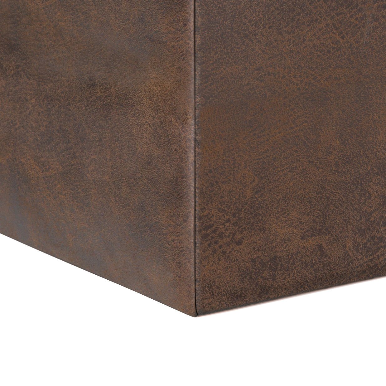 Close-up of the corner of the Rockwood Upholstered Cube Storage Ottoman With Tray, featuring a brown leather-textured finish and visible seams, shown against a white background.
