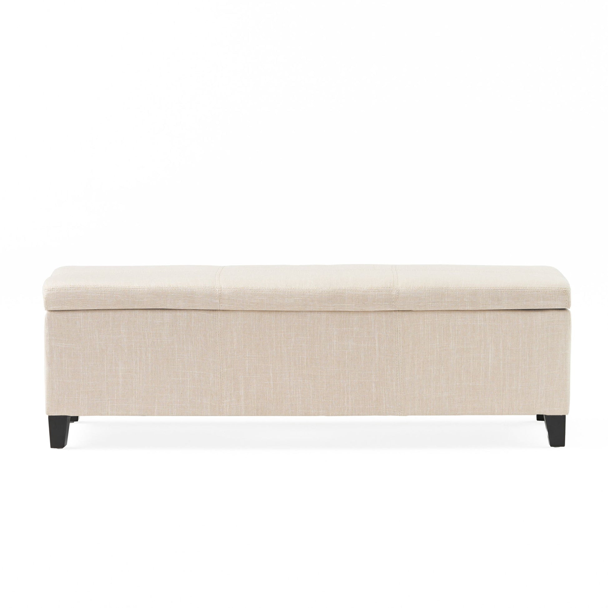 The Glouster - Contemporary Storage Ottoman is a rectangular beige upholstered bench with a cushioned top and four short dark wooden legs, shown against a plain white background.