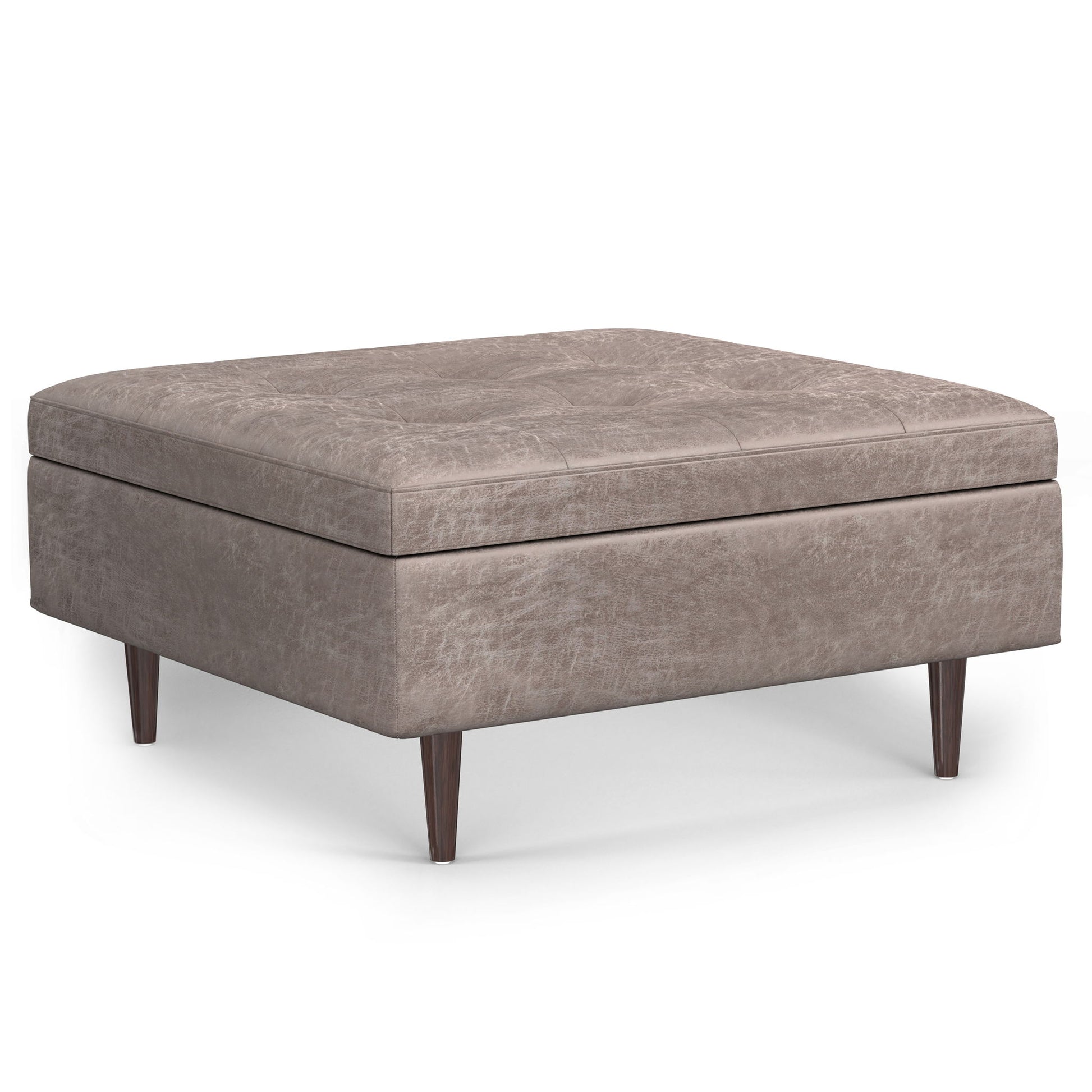 The Shay Large Square Coffee Table Storage Ottoman features a light brown upholstery, short tapered wooden legs, and a modern mid-century design.