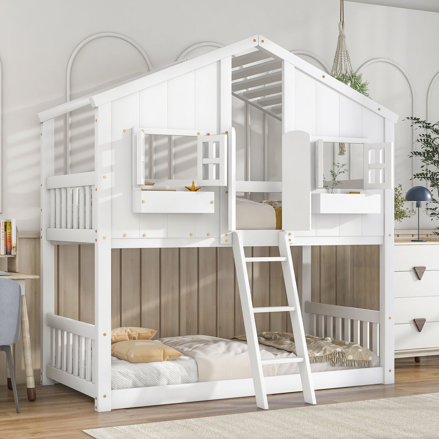 The House Bunk Bed With Roof, Window, Window Box, Door, Safety Guardrails, and Ladder is a white wooden bunk bed styled like a house with bedding on both levels, perfect for a cozy, sunlit children’s bedroom.