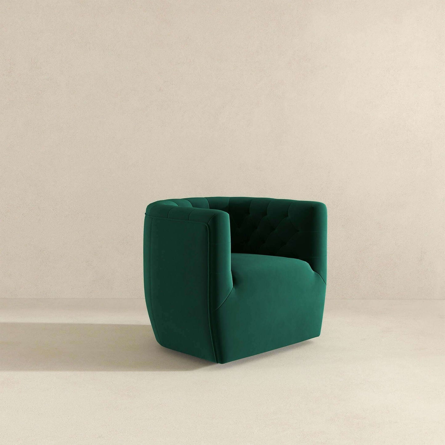 The Delaney Ergonomic Design Swivel Chair, featuring modern green velvet upholstery and a tufted backrest, stands on a light beige floor against a matching plain beige wall.