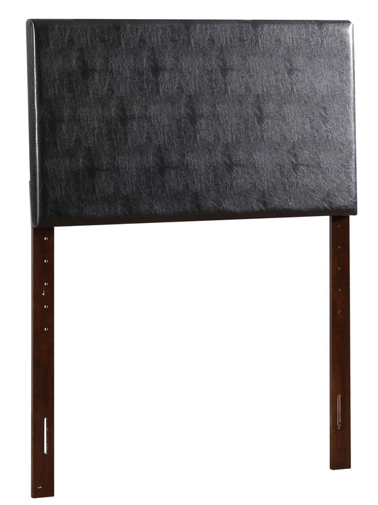 The Nova - Headboard is a rectangular, padded headboard upholstered in black faux leather, featuring two wooden legs and multiple height adjustment slots.