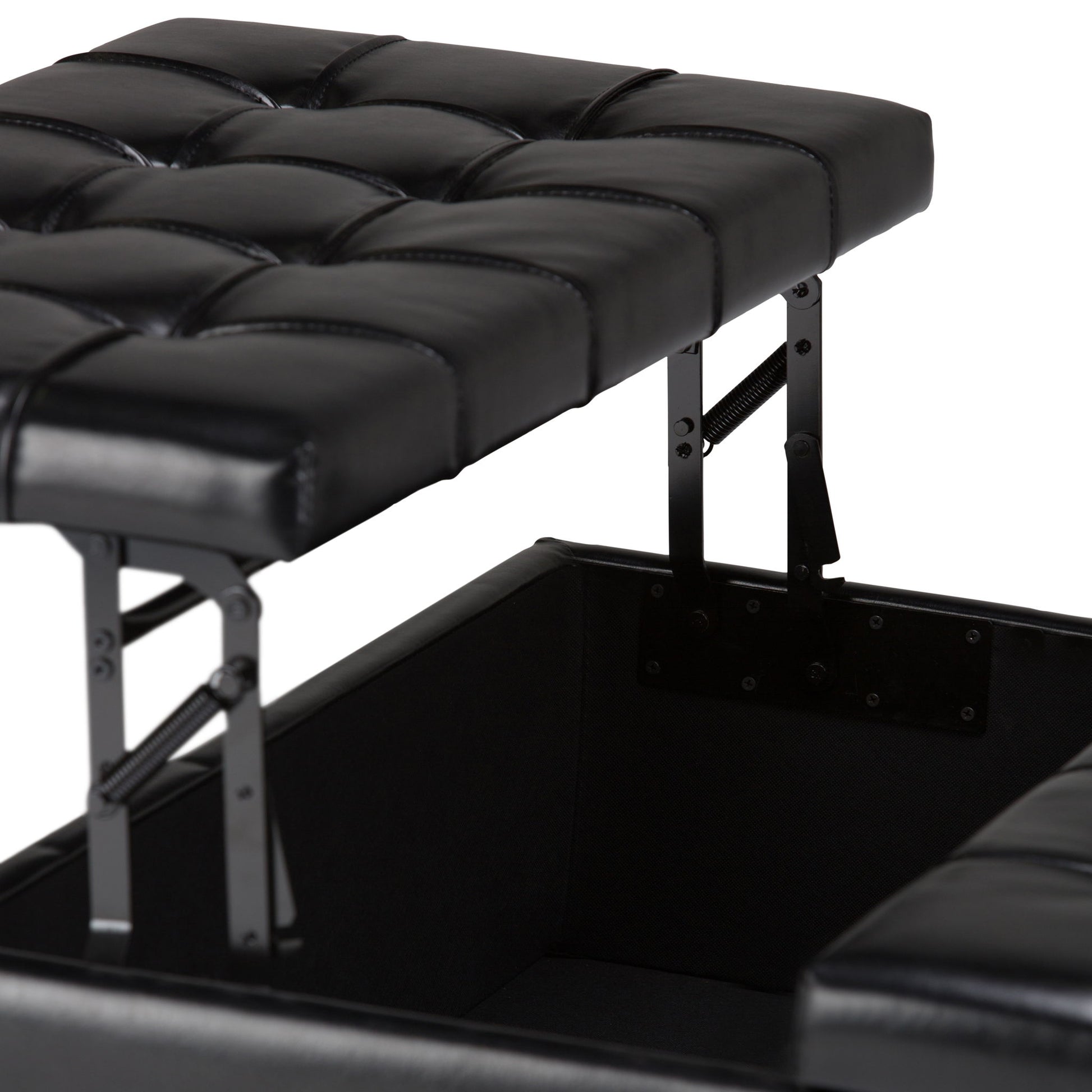 A close-up of the Harrison - Large Coffee Table Storage Ottoman in black faux leather, featuring tufted detailing and a lift-top lid with metal hinges that reveals a spacious storage compartment inside.