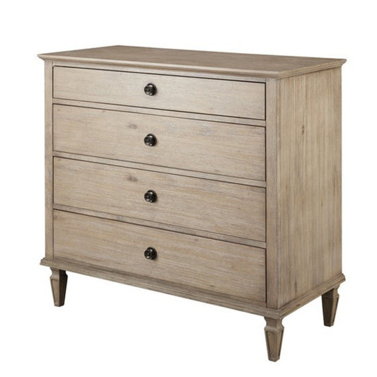 The French Inspired Small Dresser in wire brushed light natural wood features four drawers with round black knob handles, simple tapered legs, and a smooth rectangular top.