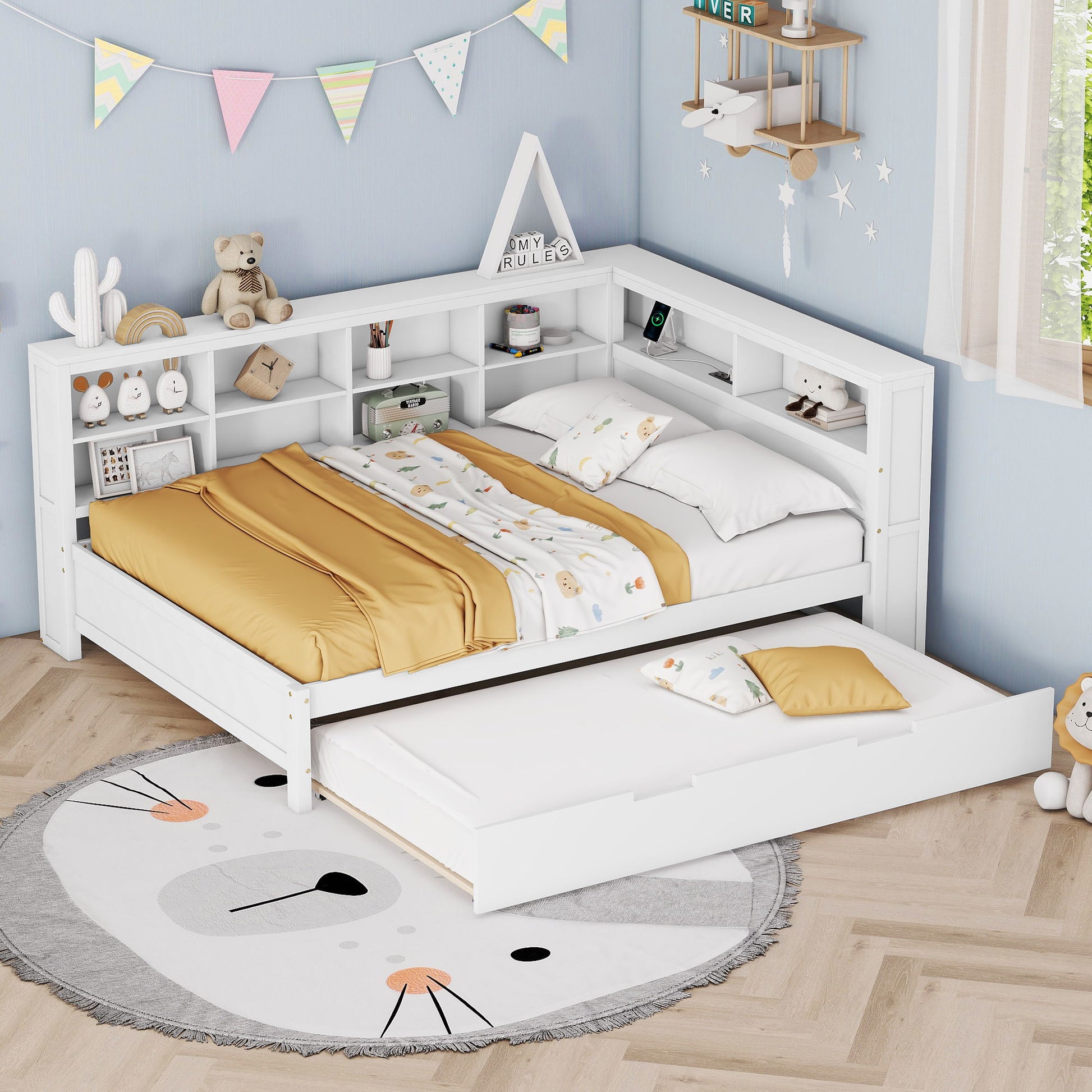 A cozy kids’ bedroom with the Wooden Full Size Daybed With Twin Size Trundle, featuring built-in shelves, USB ports, white finish, mustard yellow bedding, stuffed animals, books, and playful decor against pastel blue walls.