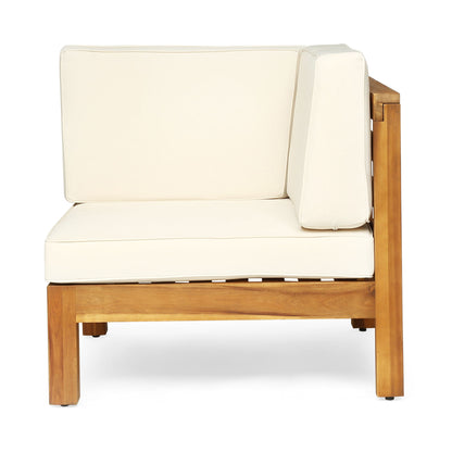 The Oana 3 Piece Love Seat Set features a modern, minimalist design with natural wood frames and cream-colored cushions on the seat, back, and side. The set includes a corner chair and coffee table for stylish comfort.