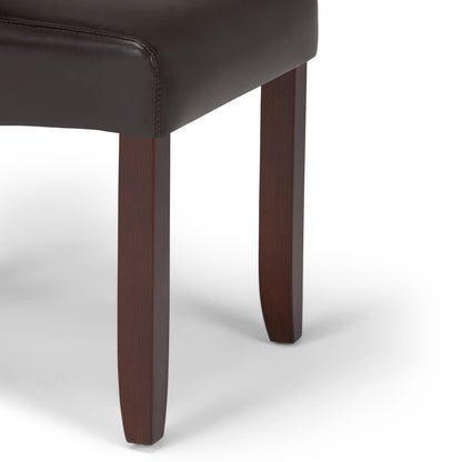 Close-up of the Cosmopolitan - Deluxe Tufted Parson Upholstered Chair, showcasing its dark brown wooden legs and dark leather or faux-leather seat against a white background.