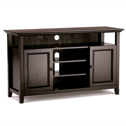 The Amherst - TV Media Stand, Handcrafted, features a dark wood finish, open center shelves, two side cabinets with doors, a large top open compartment, and a circular cable management hole in the back panel.