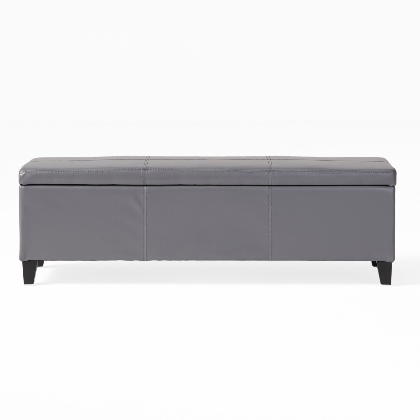 The Glouster - Contemporary Storage Ottoman features a rectangular gray design with a padded top, stitched details, and short black legs, shown against a plain white background.