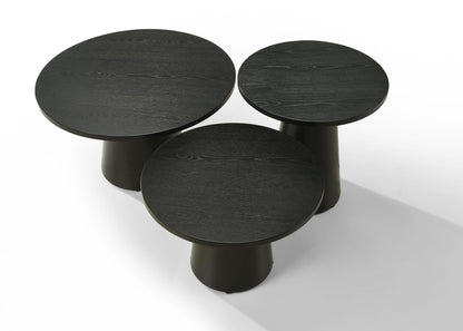 The Jasper 3 Piece Coffee, End, and Console Table Set in Ebony Black features three round wooden tables of different heights arranged together on a white background for a modern, minimalist look.