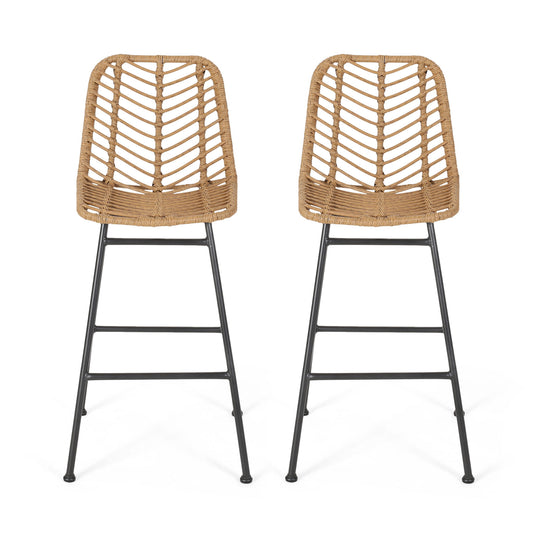 The Sawtelle Outdoor Wicker Barstools (Set of 2) feature tall chairs with chevron-patterned woven rattan seats and backs, slender black metal legs, and footrests, all displayed against a plain white background.