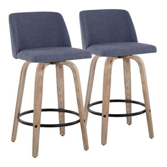 The Toriano set includes two contemporary fixed-height counter stools with swivel, curved light wood legs, round black metal footrests, and blue upholstered seats and backs, shown side by side against a white background.