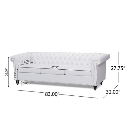 The Chesterfield Style 3 Seater Sofa with deep button tufting features rolled arms and nailhead trim. Dimensions: 83"W x 32"D x 27.75"H; arm height: 26", seat: 18.75"H x 22"D x 67.5"W, leg height: 5".