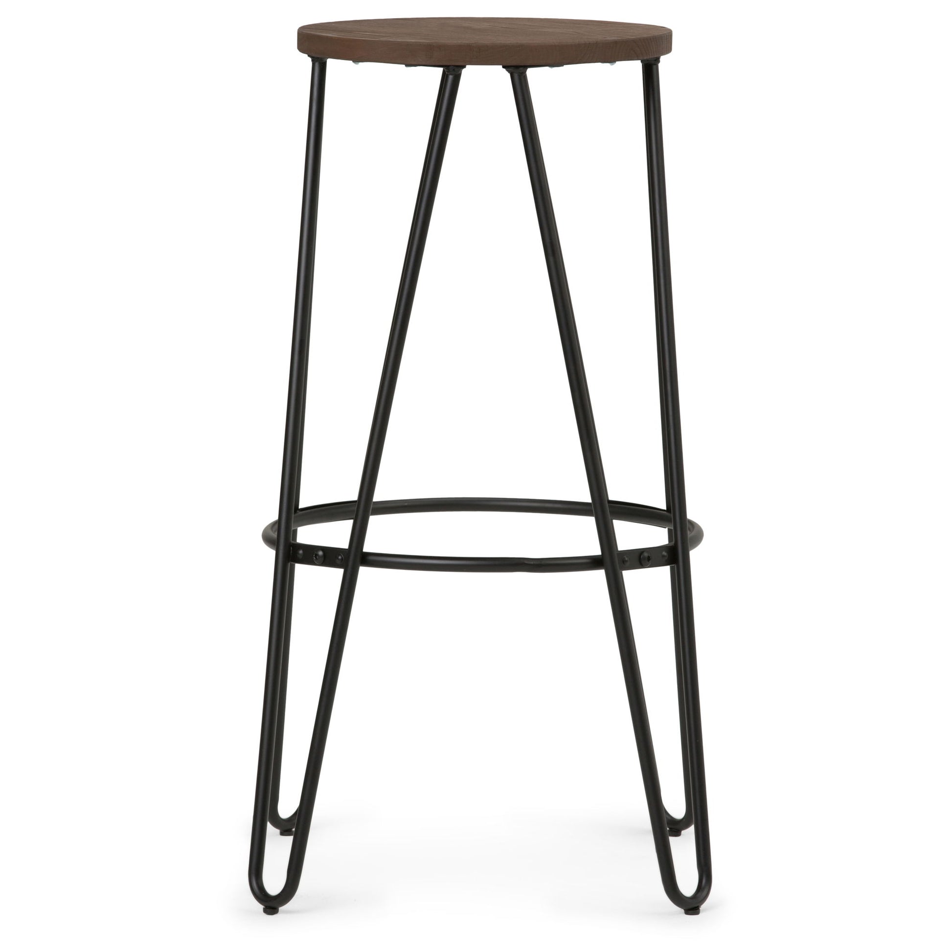 The Simeon Multifunctional Metal Stool features a tall, minimalist design with a round wood seat, black metal hairpin legs, and a circular footrest connecting the legs near the base.