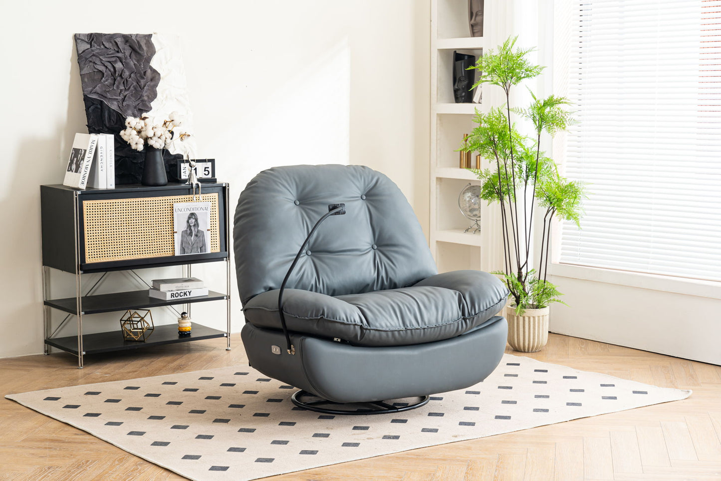 A modern living room featuring the Power Recliner Swivel Glider with USB charger and Bluetooth music player, set on a patterned rug beside a black and rattan cabinet, decor items, a potted plant, and white shelves by a window with blinds.
