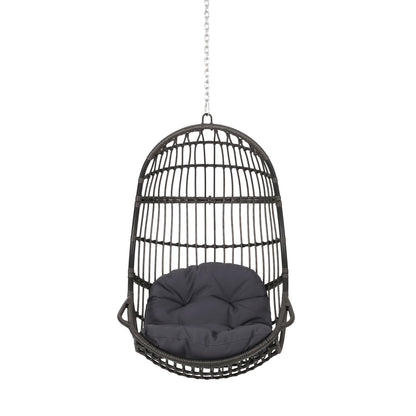 The Rustic Hanging Basket Chair With Cushion is a black egg-shaped rattan chair with a grey cushion, suspended from a metal chain and shown against a white background.