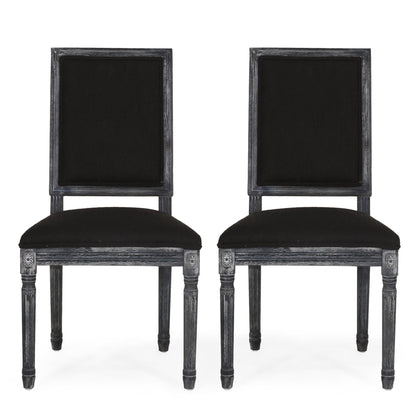 Two French Country Style Dining Chairs with upholstered seats, fluted legs, and square backs in black, feature dark wood frames and are positioned side by side against a plain white background.