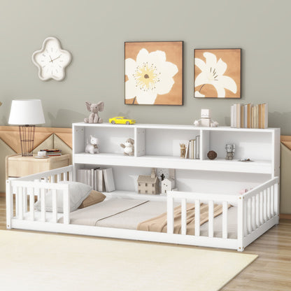 A children's bedroom with a Floor Bed With Bedside Bookcase, Shelves, Guardrails in white, surrounded by toys and books, flower wall art, a flower-shaped clock, a lamp, and light-colored decor.