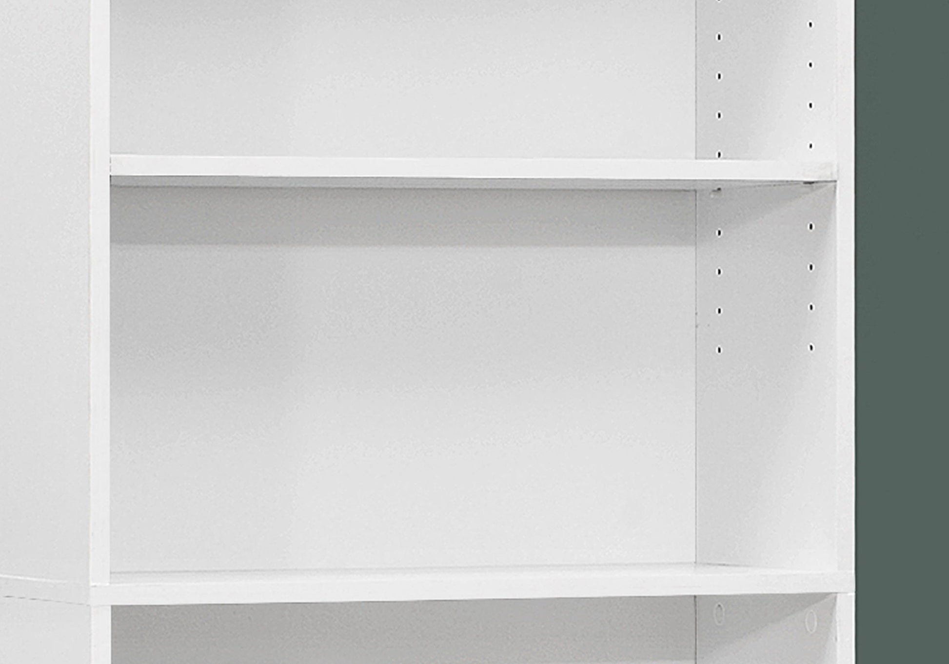 A close-up of the 6 Tier Bookshelf Bookcase for Office, featuring adjustable shelves with multiple holes on the side panels for height options, shown empty against a green wall. Transitional design.
