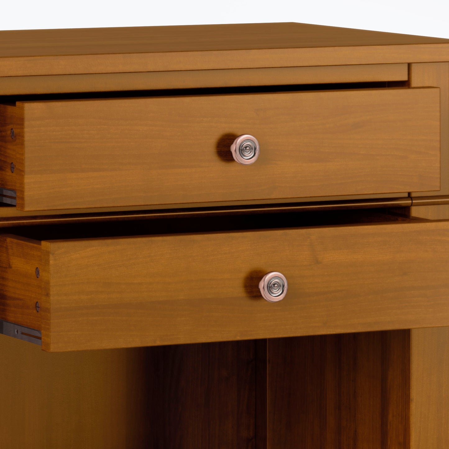 Close-up of the Carlton Handcrafted Bedside Table, showing two partially open drawers with round silver knobs and a warm medium-brown wood finish.
