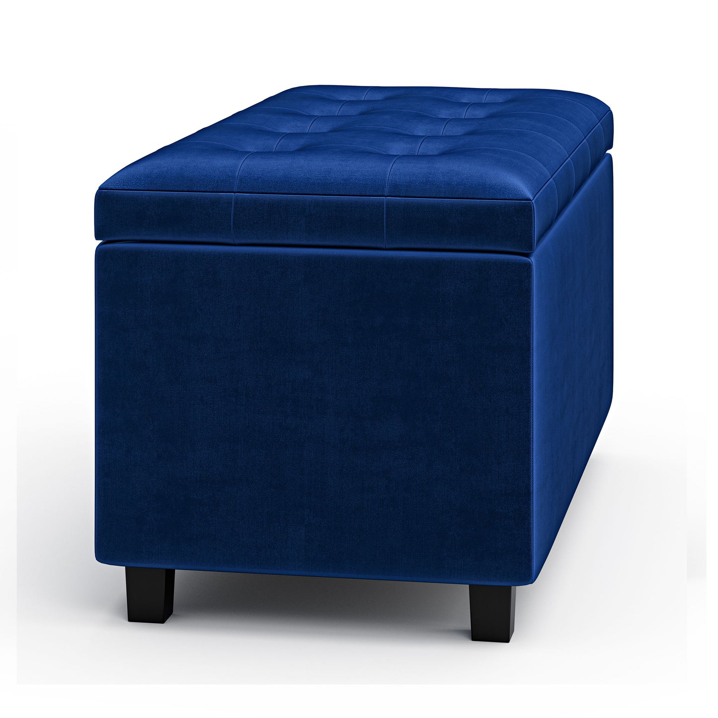 The Cosmopolitan Upholstered Storage Ottoman is rectangular, blue velvet with tufted top detailing and short black legs, shown against a white background.