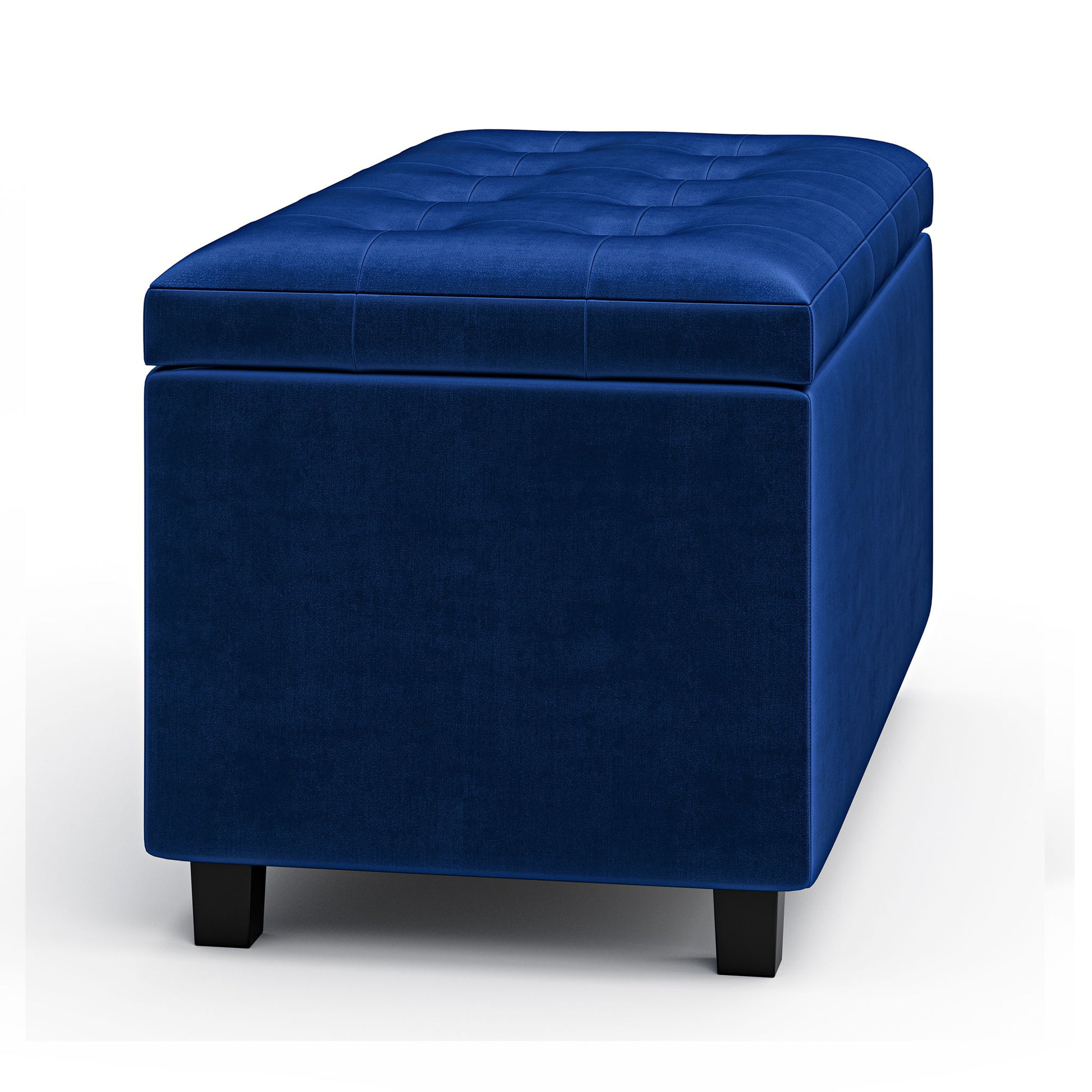The Cosmopolitan Upholstered Storage Ottoman is rectangular, blue velvet with tufted top detailing and short black legs, shown against a white background.