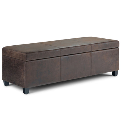 The Avalon Storage Ottoman Bench in distressed brown features a rectangular leather design with short black legs and a padded, hinged lid for storage.