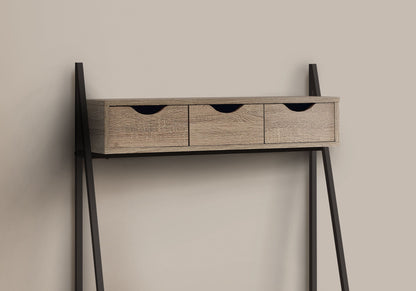 A contemporary, minimalist computer desk for home office use, featuring storage drawers and a leaning design with black metal legs, shown against a beige background.