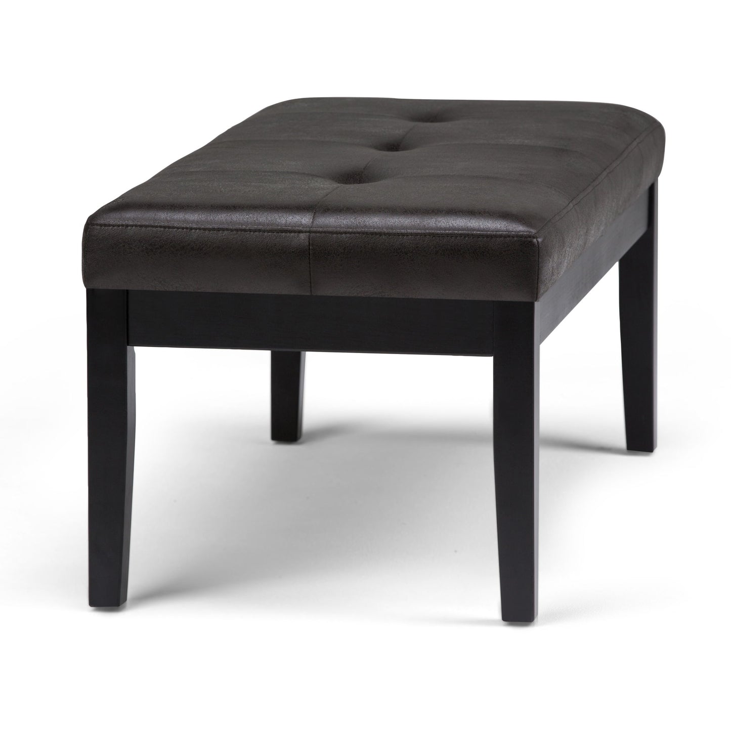 The Lacey Upholstered Tufted Ottoman Bench features a rectangular dark brown design with tufted buttons on top and four wooden legs, displayed against a plain white background.