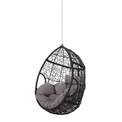 The Teardrop Hanging Chair With 8Ft Chain is a black woven egg chair with chain suspension and thick gray tufted cushions inside.