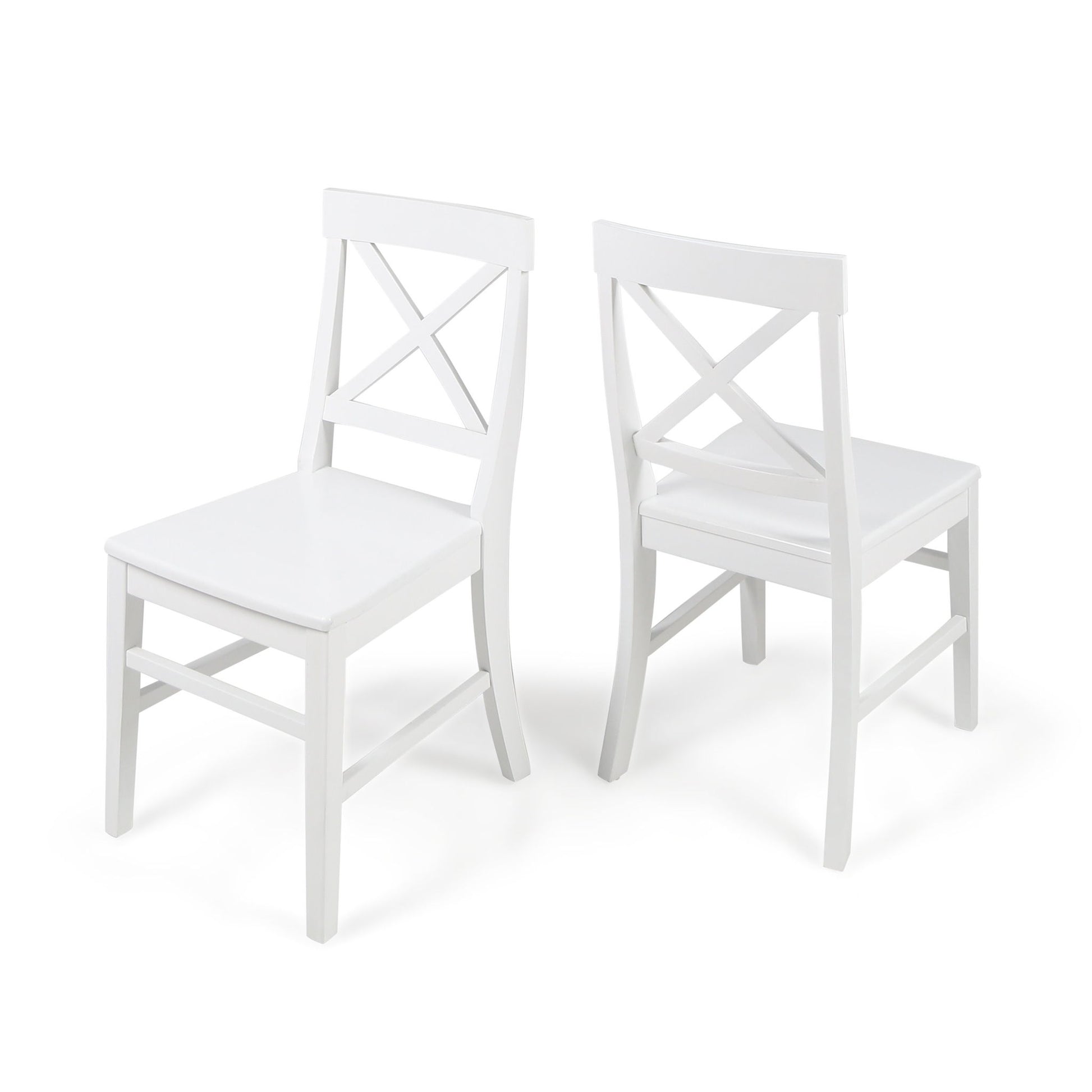 The Plethora Dining Chair With X Shaped Back (Set of 2) features two white wooden chairs, one facing forward and one backward, both showcasing X-shaped backrests against a plain white background.