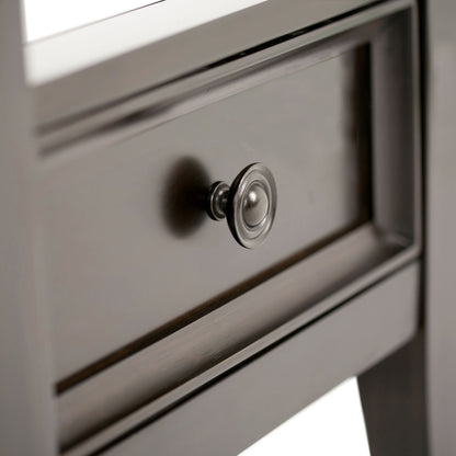 Close-up of the Amherst - Handcrafted End Table’s dark wooden drawer with a round metallic knob, highlighting the smooth wood finish and elegant handle.