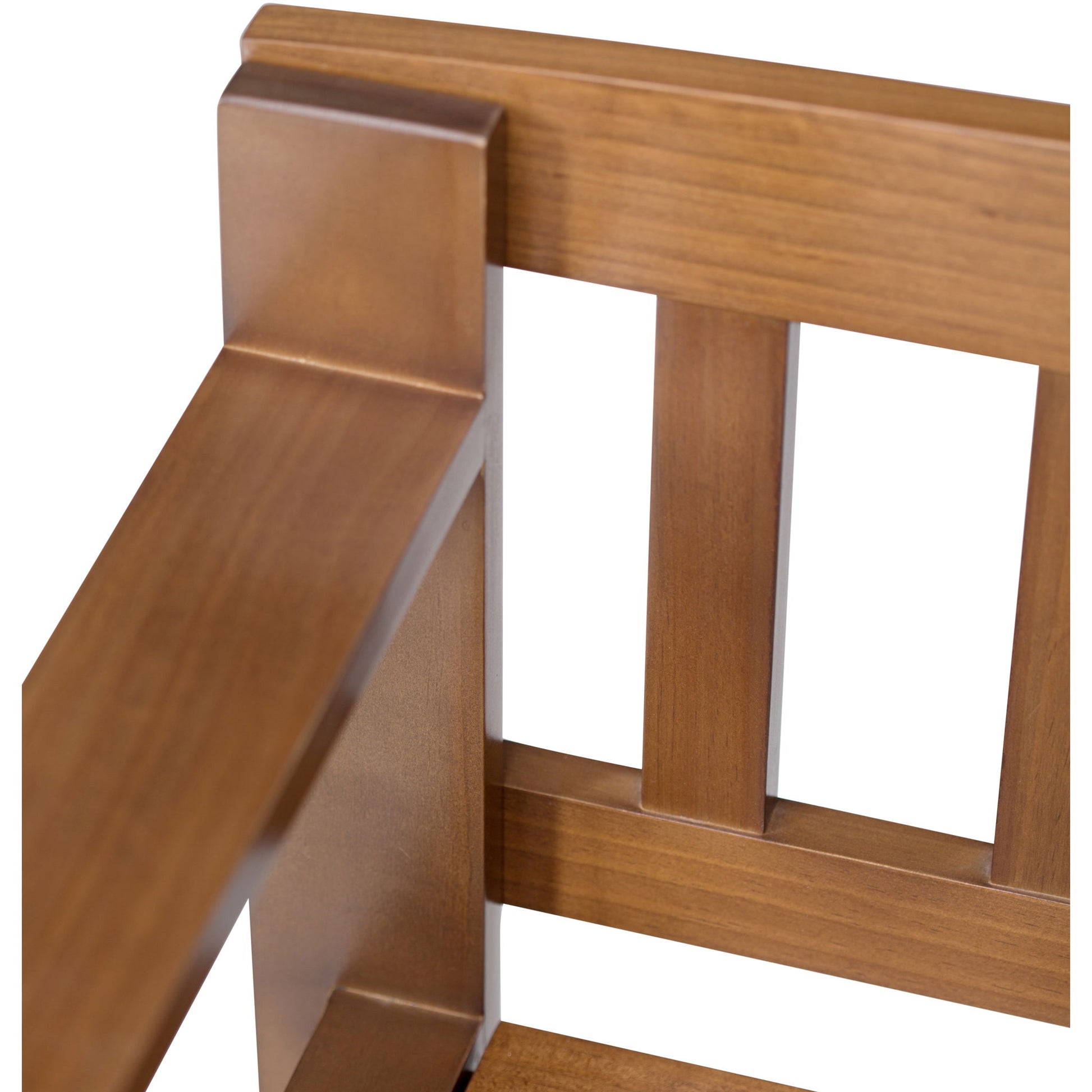 Close-up of the Brooklyn Entryway Storage Bench in medium saddle brown, highlighting the smooth wood finish and vertical slat design on the backrest, with visible armrest and seat details.
