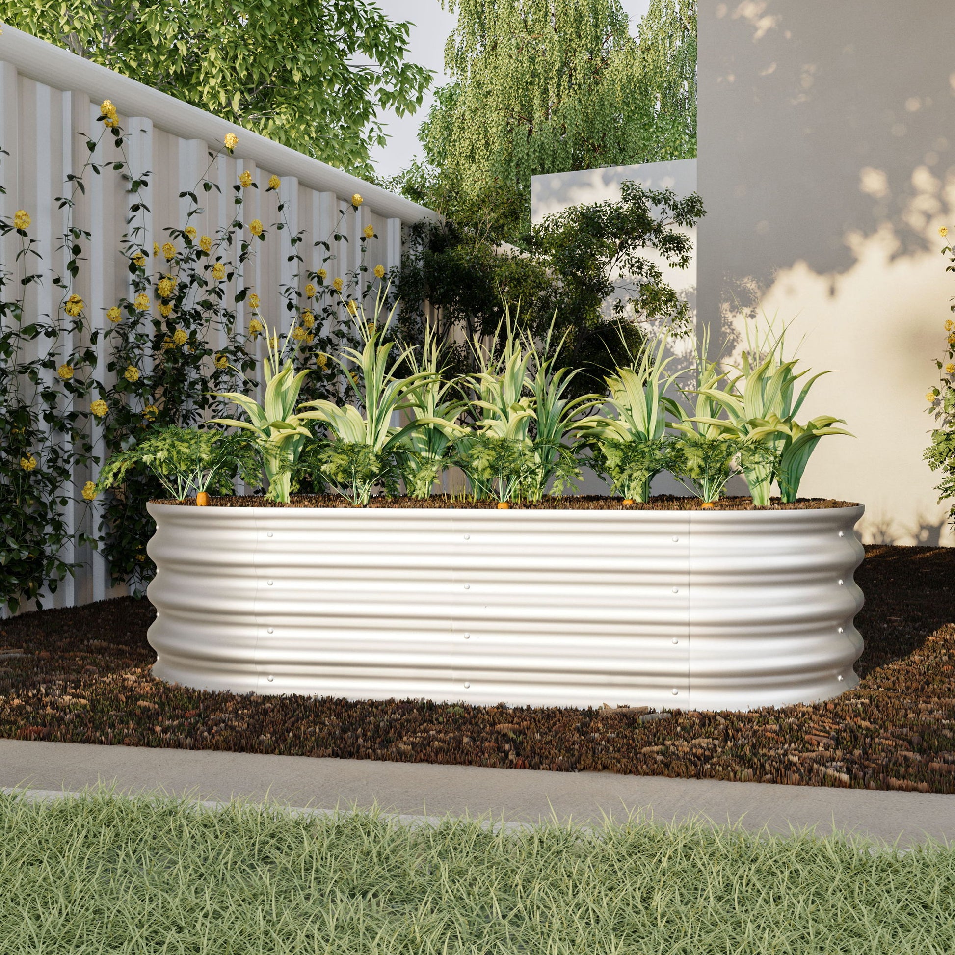 The Heavy Duty Galvanized Raised Garden Bed Kit for Vegetables, Flowers & Herbs is shown in a modern backyard, its white corrugated metal frame filled with green plants and surrounded by flowering vines, trees, and light walls.