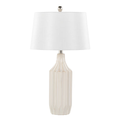 The Stella - Contemporary Table Lamp features a white, textured ceramic base with vertical grooves and a white fabric shade, finished with a small metallic finial.
