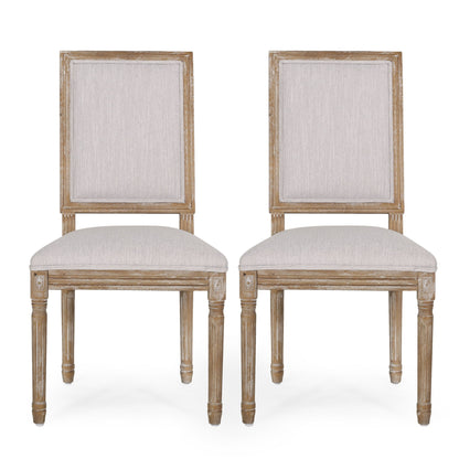 Two French Country Style Dining Chairs with light beige upholstered seats and backs, fluted legs, and a classic design are placed side by side facing forward against a white background.