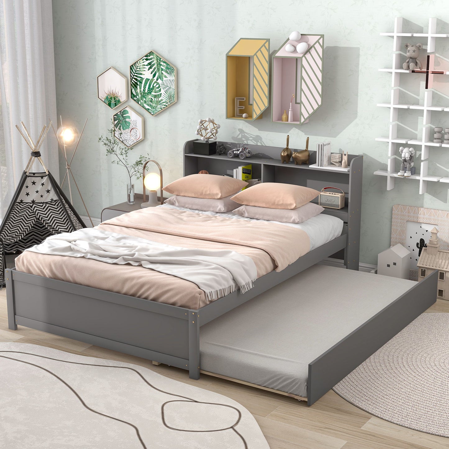 A cozy bedroom with a Full Bed With Trundle, pastel bedding, decorative wall shelves and bookcase; a play tent, lamps, and toys add playful accents to the room’s modern style.
