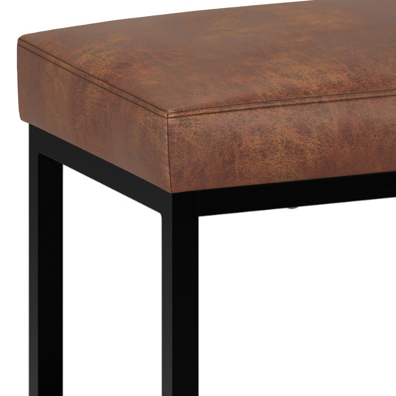 Close-up of the Reynolds Small Bench in Distressed Saddle Brown, featuring a cushioned seat and black metal legs for a modern, minimalist look.