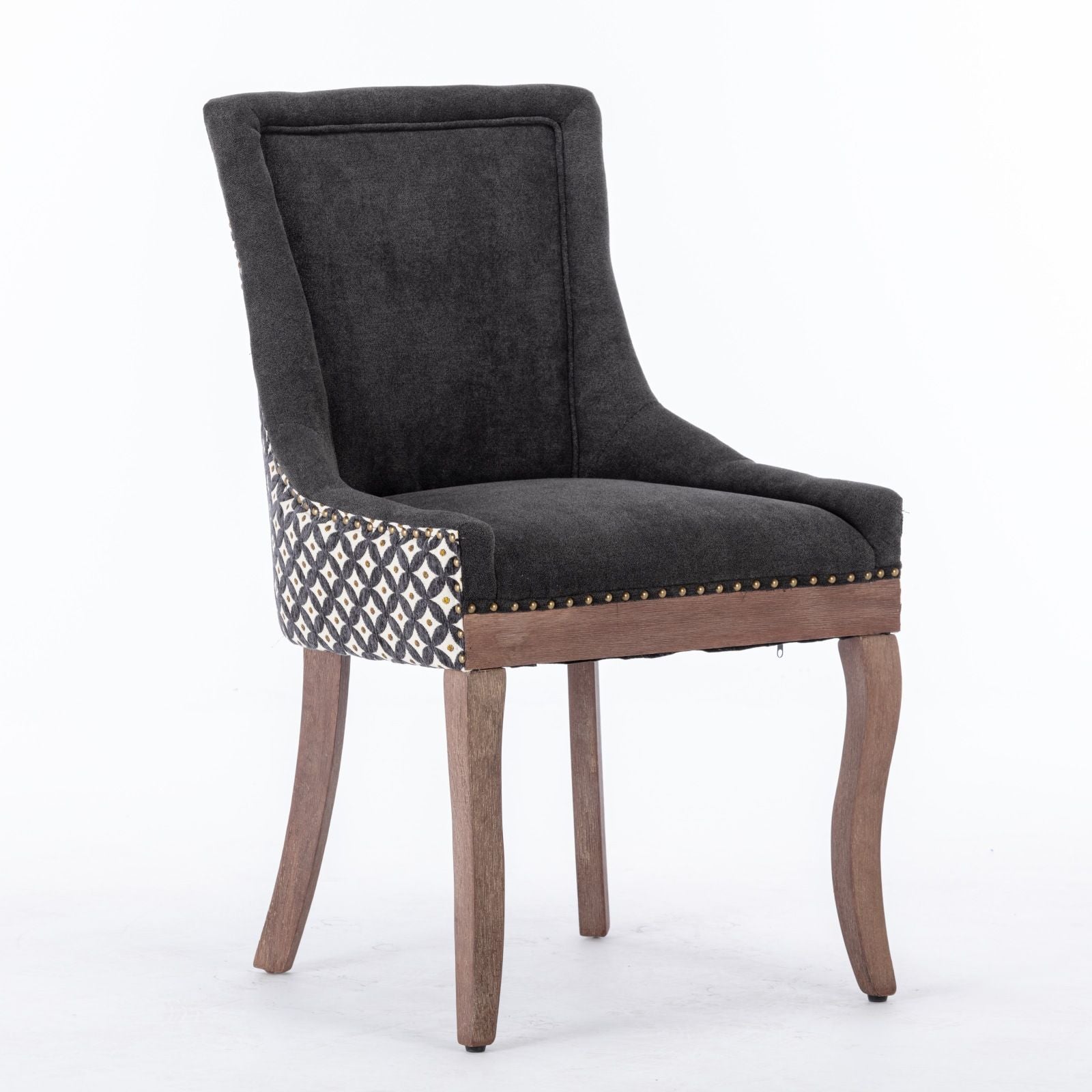 The Ultra Side Dining Chair features thickened neutral fabric, solid wood legs, patterned upholstery on the sides and back, and a bronze nailhead trim along the front edge. Set of 2.