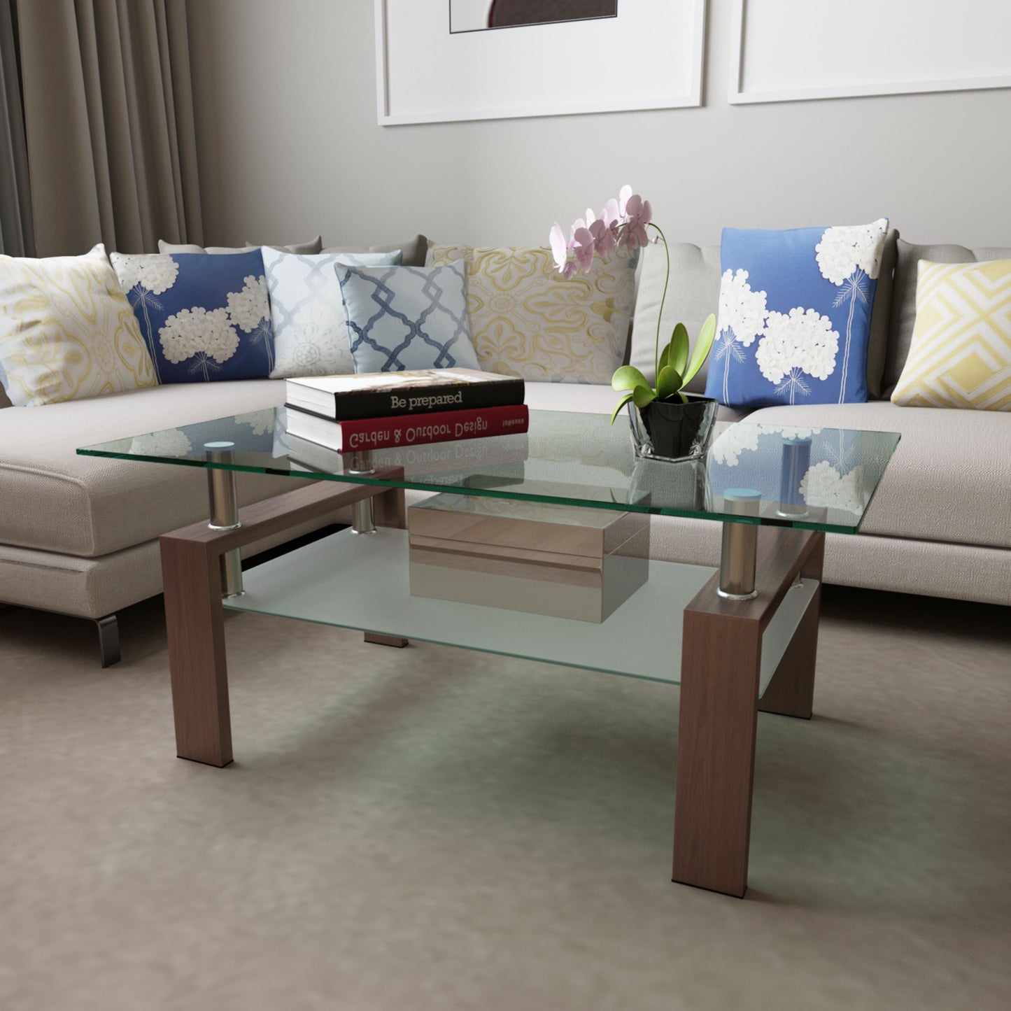 A modern living room features the Rectangle Coffee Table, Modern Side Center Tables For Furniture, displaying books, a small box, and a potted orchid, surrounded by an L-shaped sofa with blue, white, and yellow patterned cushions.