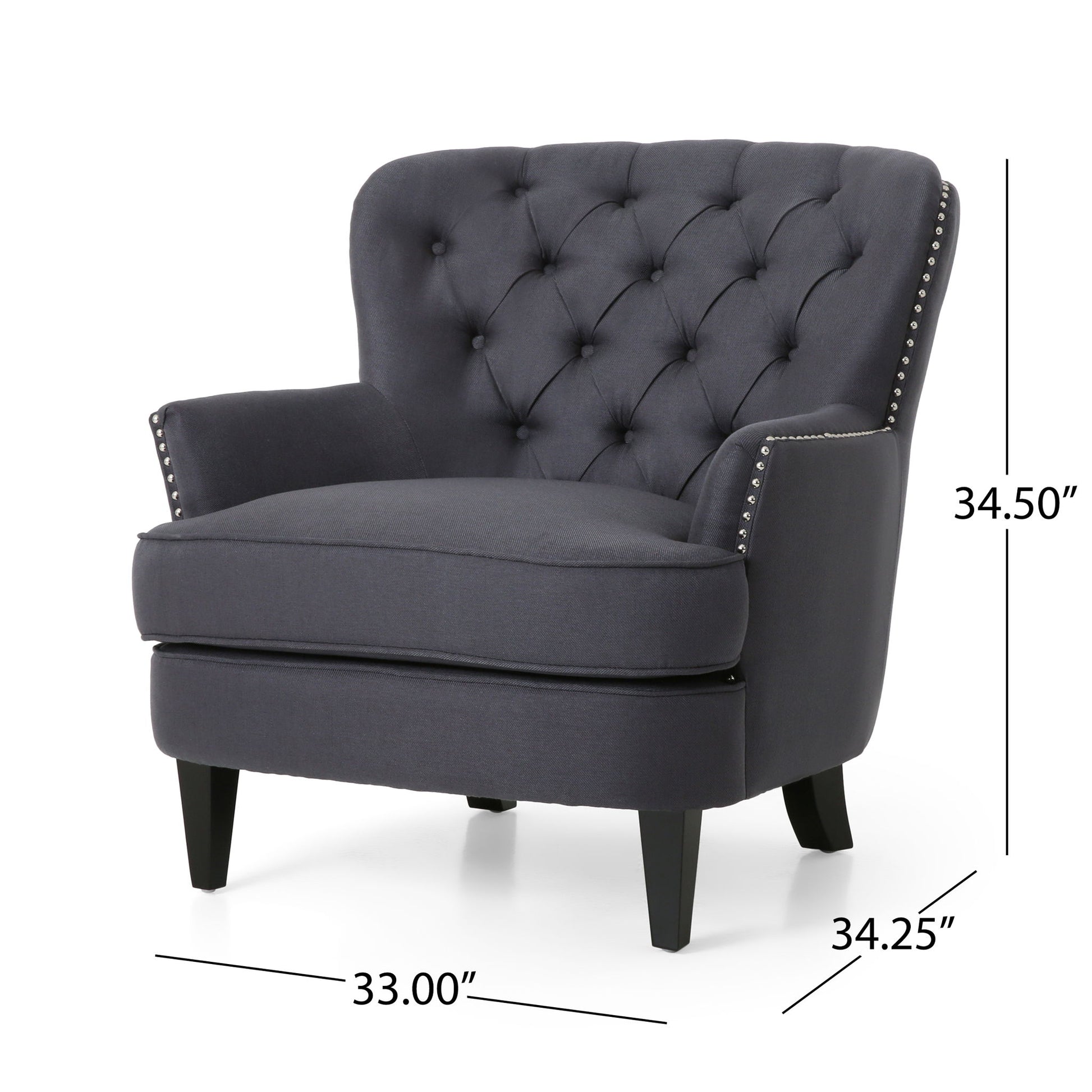 The Enchante Living Room Set features a dark gray tufted back club chair with silver nailhead trim, black wooden legs, padded arms, and a cushioned seat. Chair dimensions: 34.50" H x 33.00" W x 34.25" D. Includes ottoman.