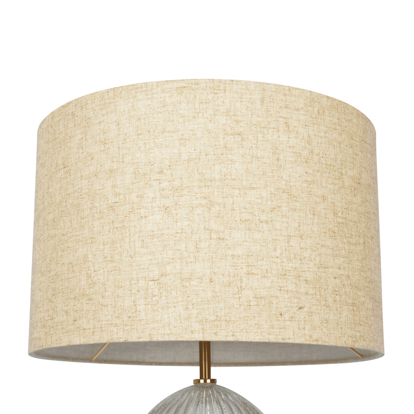 A close-up of the Aurora table lamp features a large, beige linen cylindrical shade with textured fabric, resting on a ribbed clear base. The metal rod beneath is gold-toned, set against a plain white background.